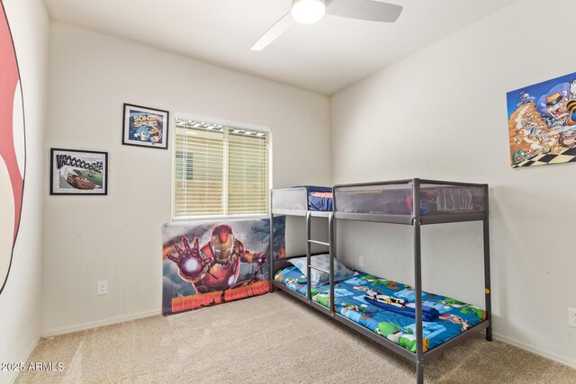 bedroom featuring baseboards, a ceiling fan, and carpet floors