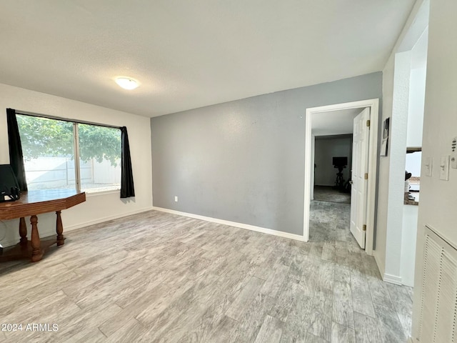 empty room with light wood-type flooring