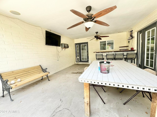 view of patio featuring ceiling fan