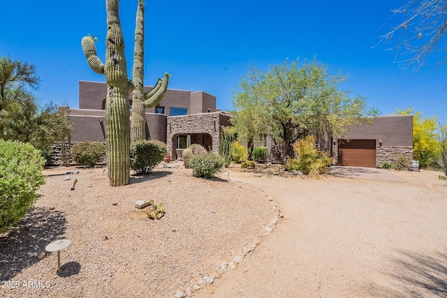 8606 E Arroyo Seco Rd, Scottsdale, AZ 85266 - pueblo revival-style home with stucco siding and stone siding