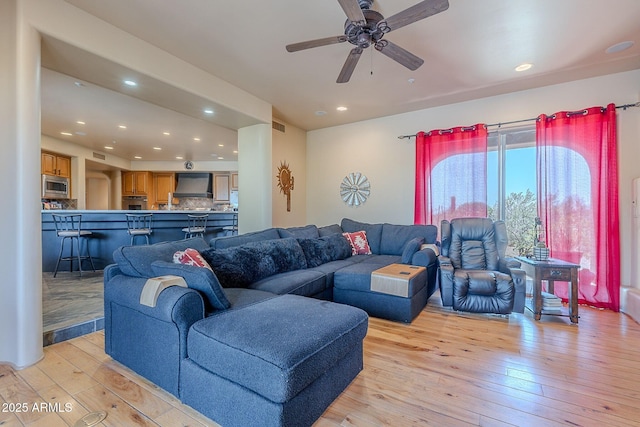 8606 E Arroyo Seco Rd, Scottsdale, AZ 85266 - living area with light wood-style floors, a ceiling fan, and recessed lighting