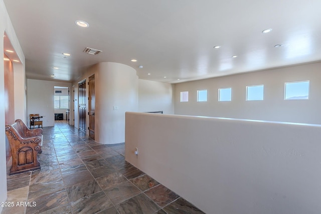 8606 E Arroyo Seco Rd, Scottsdale, AZ 85266 - hall featuring recessed lighting and dark stone finish flooring