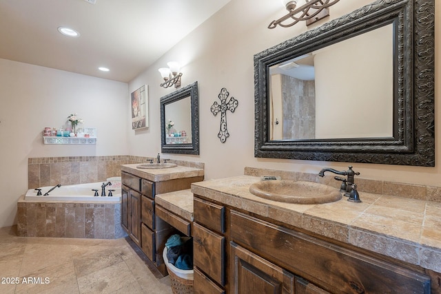 8606 E Arroyo Seco Rd, Scottsdale, AZ 85266 - full bath with a bath, two vanities, and recessed lighting