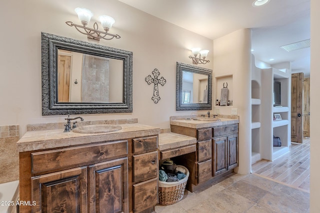 8606 E Arroyo Seco Rd, Scottsdale, AZ 85266 - full bathroom with a chandelier, vanity, and recessed lighting