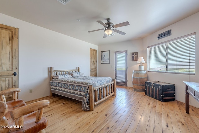 8606 E Arroyo Seco Rd, Scottsdale, AZ 85266 - bedroom featuring light wood-type flooring and a ceiling fan