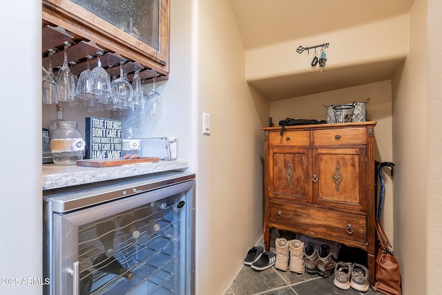 8606 E Arroyo Seco Rd, Scottsdale, AZ 85266 - indoor dry bar featuring beverage cooler and tile patterned flooring