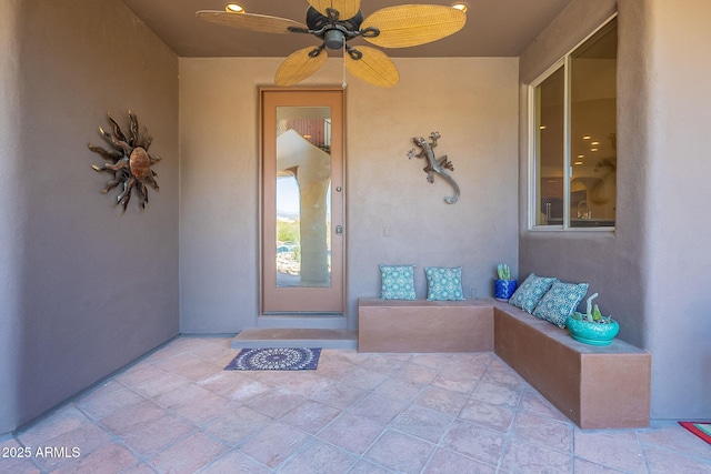 8606 E Arroyo Seco Rd, Scottsdale, AZ 85266 - doorway to property with stucco siding, ceiling fan, and a patio area