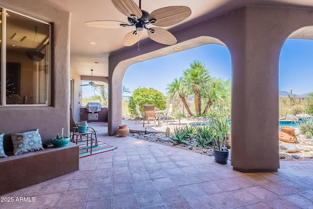 8606 E Arroyo Seco Rd, Scottsdale, AZ 85266 - view of patio featuring a ceiling fan, outdoor dining area, and a fenced backyard