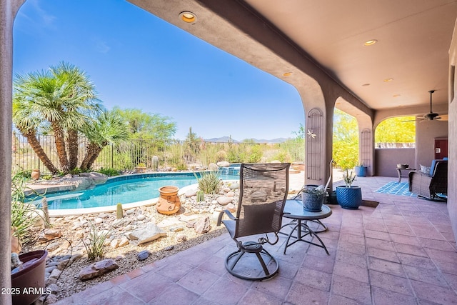 8606 E Arroyo Seco Rd, Scottsdale, AZ 85266 - view of patio with a mountain view, fence, and ceiling fan