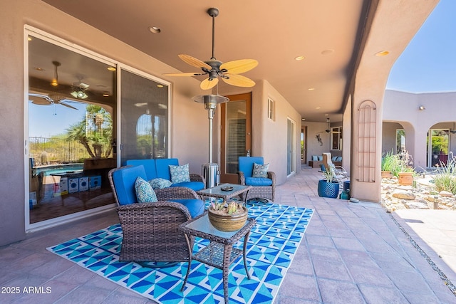 8606 E Arroyo Seco Rd, Scottsdale, AZ 85266 - view of patio / terrace with a ceiling fan and an outdoor living space