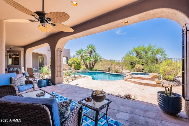 8606 E Arroyo Seco Rd, Scottsdale, AZ 85266 - view of patio / terrace with ceiling fan, a pool with connected hot tub, and a fenced backyard