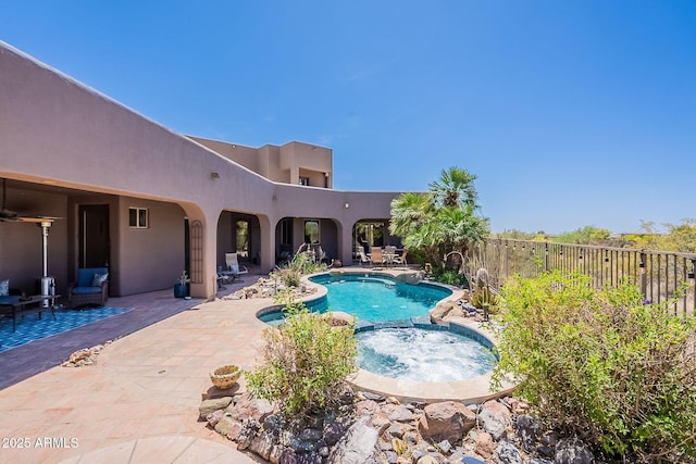 8606 E Arroyo Seco Rd, Scottsdale, AZ 85266 - view of swimming pool featuring a patio, fence, and a pool with connected hot tub