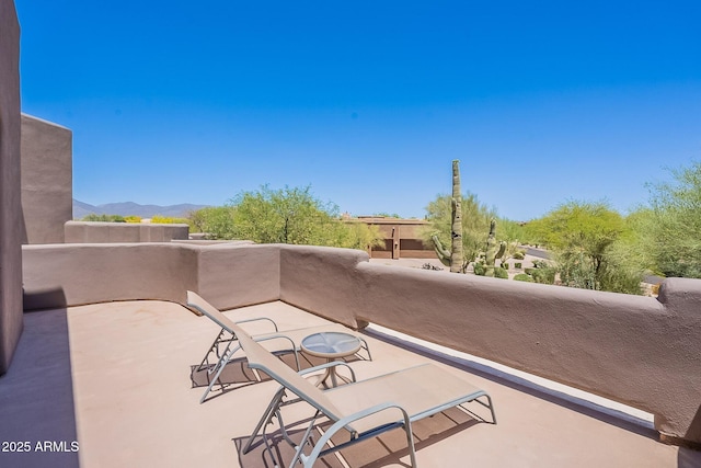 8606 E Arroyo Seco Rd, Scottsdale, AZ 85266 - view of patio with a balcony and a mountain view