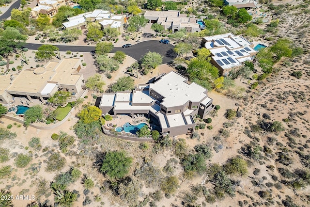 8606 E Arroyo Seco Rd, Scottsdale, AZ 85266 - aerial overview of property's location with a pool area and nearby suburban area