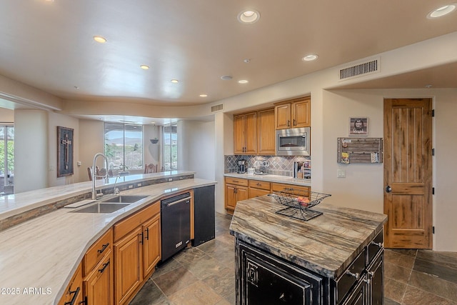 8606 E Arroyo Seco Rd, Scottsdale, AZ 85266 - kitchen with a sink, stainless steel microwave, dishwasher, recessed lighting, and stone tile floors