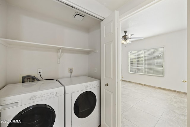 laundry room with light tile patterned floors, visible vents, a ceiling fan, washing machine and dryer, and laundry area