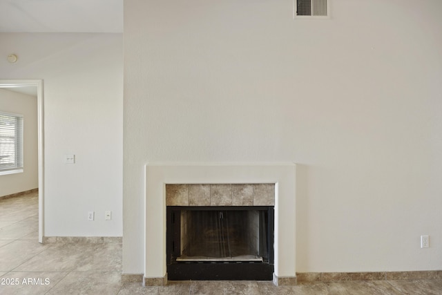 interior details featuring visible vents and a fireplace