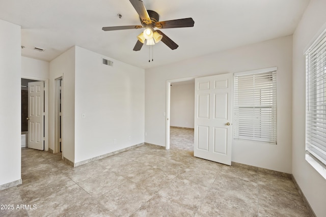 unfurnished bedroom with ceiling fan, visible vents, and baseboards