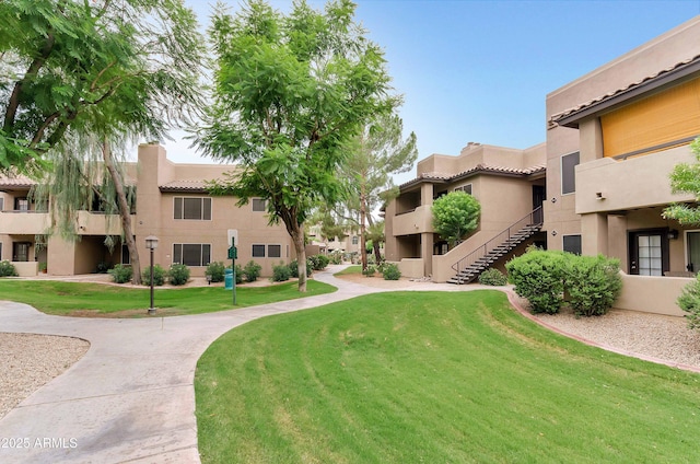 view of home's community featuring a yard