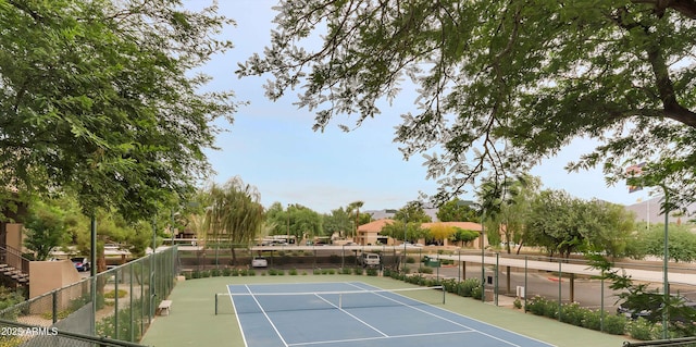 view of sport court with fence