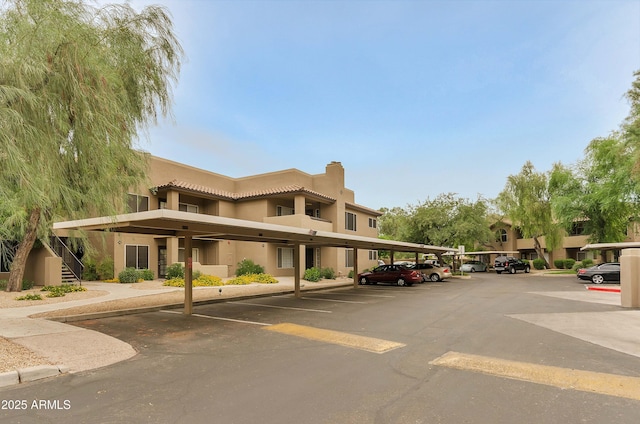 view of property featuring covered parking