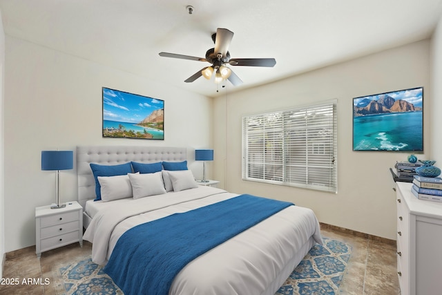 bedroom with baseboards and a ceiling fan