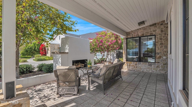 view of patio / terrace with exterior fireplace