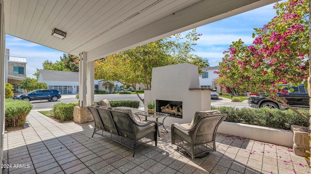 view of patio / terrace with exterior fireplace