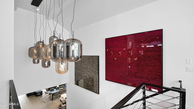 details featuring wood-type flooring and a notable chandelier