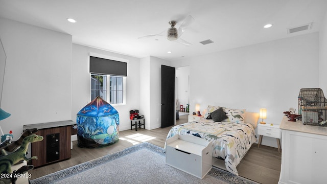 bedroom featuring light hardwood / wood-style flooring and ceiling fan