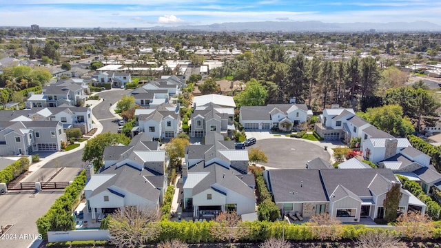 birds eye view of property with a mountain view