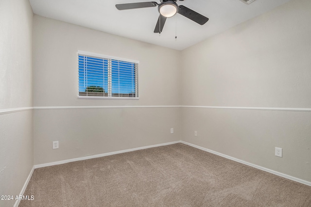 empty room featuring ceiling fan and carpet flooring