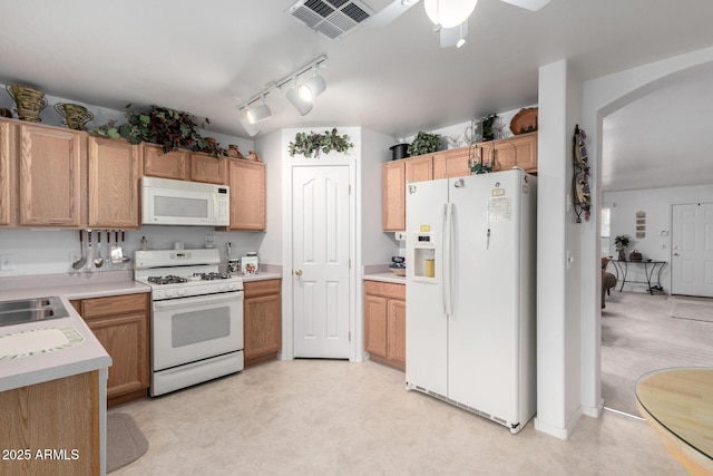 kitchen with white appliances and track lighting