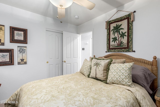 bedroom featuring ceiling fan and a closet