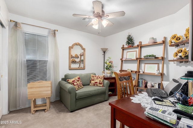 carpeted home office with ceiling fan