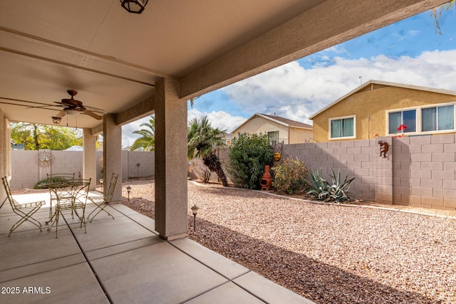 view of patio featuring ceiling fan