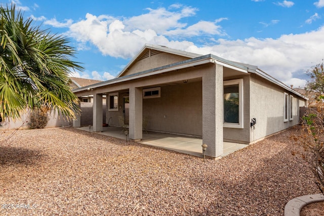 back of property featuring a patio