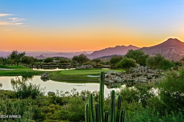 surrounding community featuring a water and mountain view