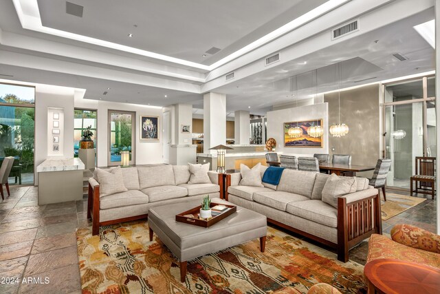 living room featuring a tray ceiling