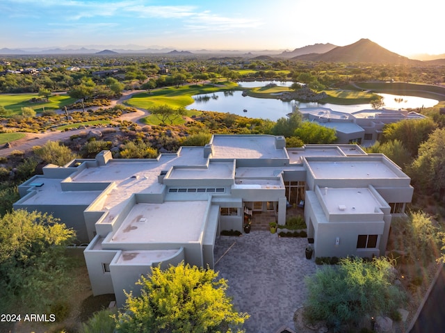 birds eye view of property featuring a water and mountain view