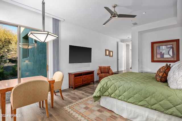 bedroom featuring ceiling fan and hardwood / wood-style flooring