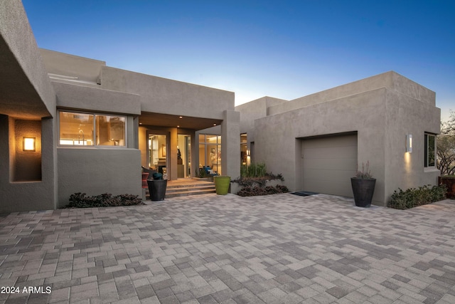 adobe home featuring a garage