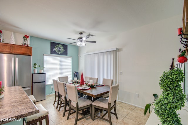 dining room with ceiling fan and light tile patterned floors