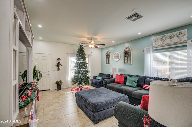 living room featuring ceiling fan and light tile patterned flooring