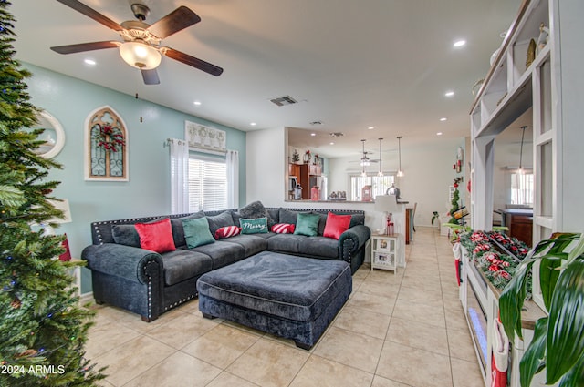 tiled living room featuring ceiling fan