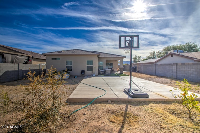 rear view of property featuring a patio