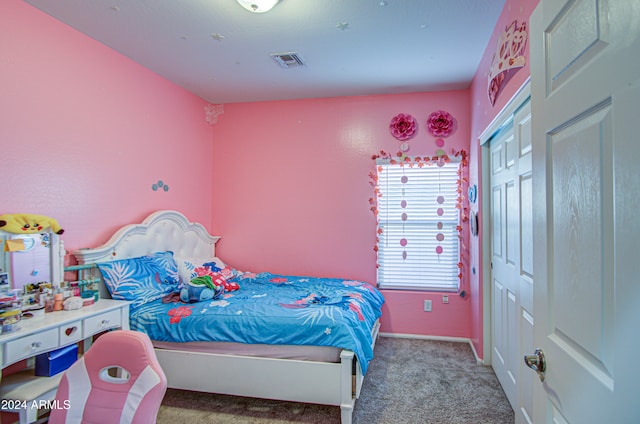 bedroom featuring carpet and a closet