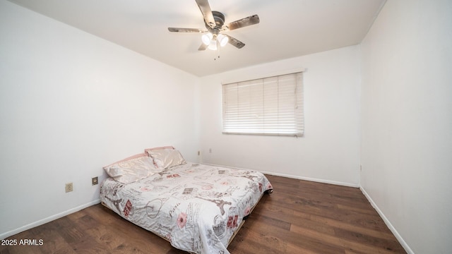 bedroom featuring dark hardwood / wood-style flooring and ceiling fan