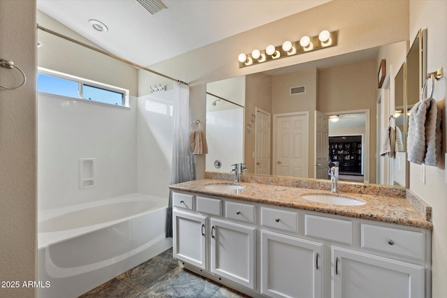 25818 N 68th Ave, Peoria, AZ 85383 - bathroom with washtub / shower combination, double vanity, ceiling fan, and stone finish floors