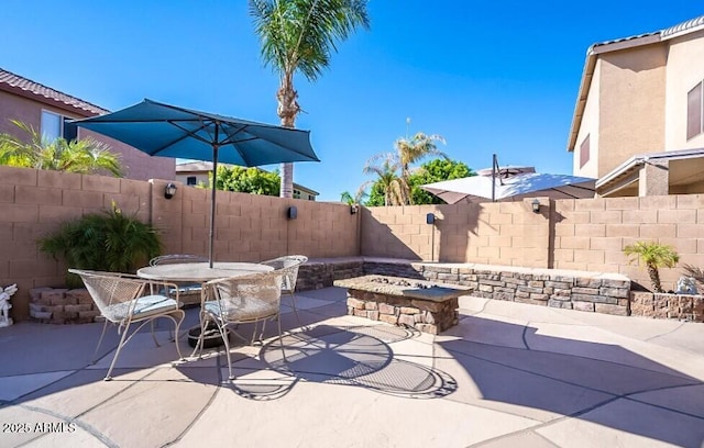 25818 N 68th Ave, Peoria, AZ 85383 - fenced backyard featuring an outdoor fire pit, a patio, and outdoor dining space
